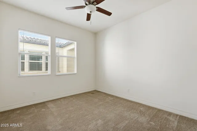 a bathroom with a double vanity sink a mirror and a bathtub