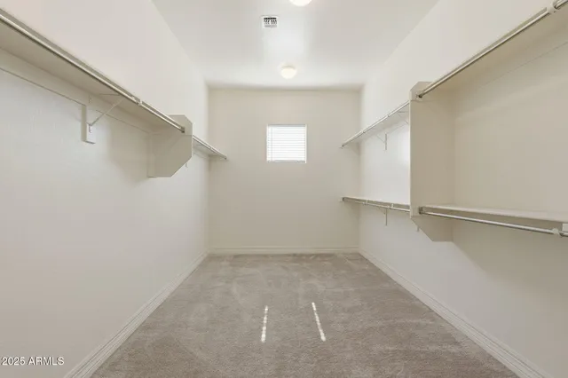 a view of a swimming pool with a yard and palm trees