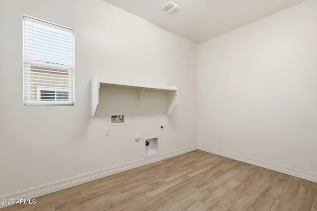 a view of a patio with a table chairs and a patio