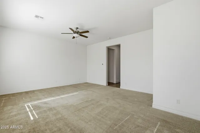 a view of an empty room with glass door