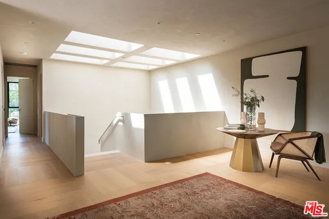 a view of a hallway with seating area