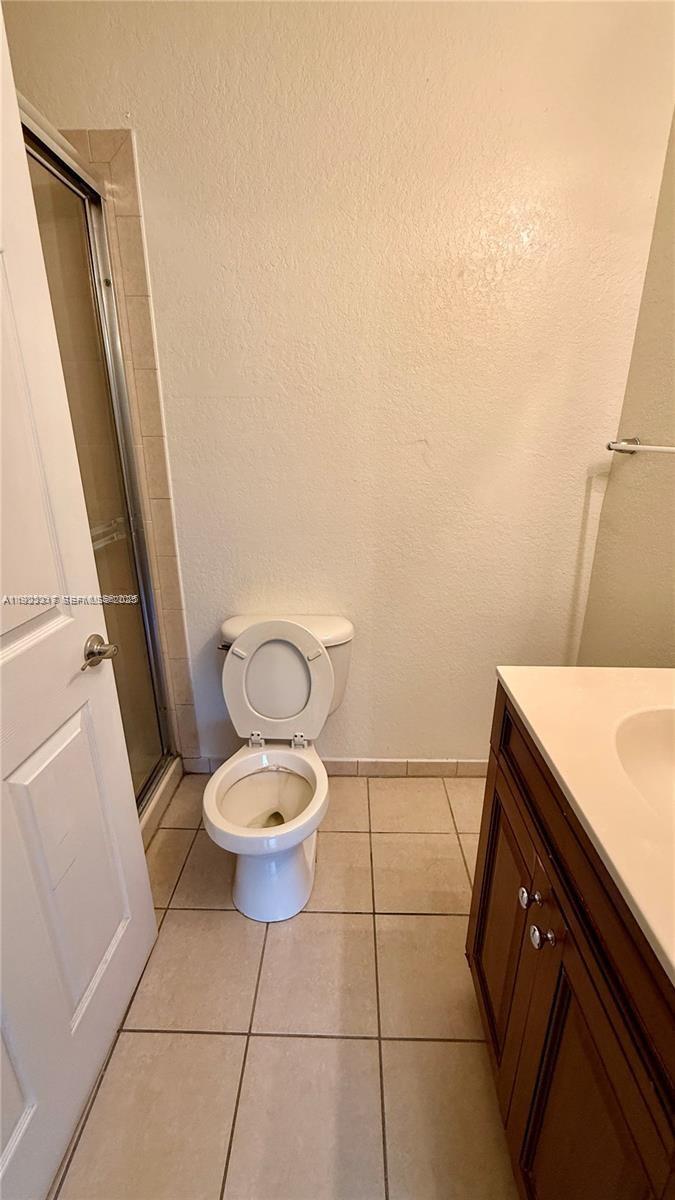 1918 Alamanda Way Riviera Beach, FL 33404 - Photo 13 of 23 a bathroom with a toilet and a sink