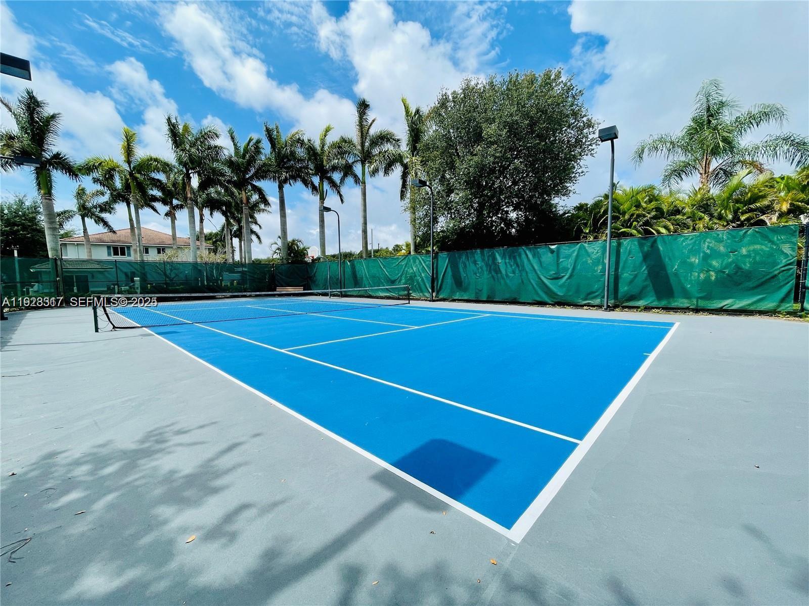 1918 Alamanda Way Riviera Beach, FL 33404 - Photo 20 of 23 a view of a tennis court