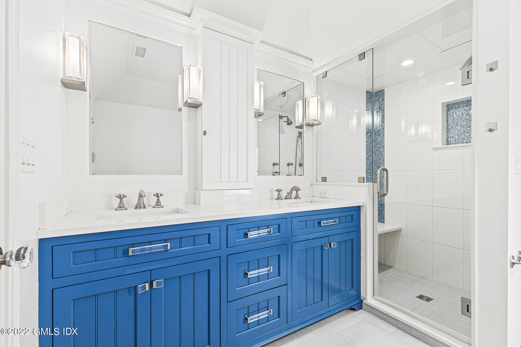 65 Doubling Road Greenwich, CT 06830 - Photo 12 of 18 a bathroom with a granite countertop sink mirror and double