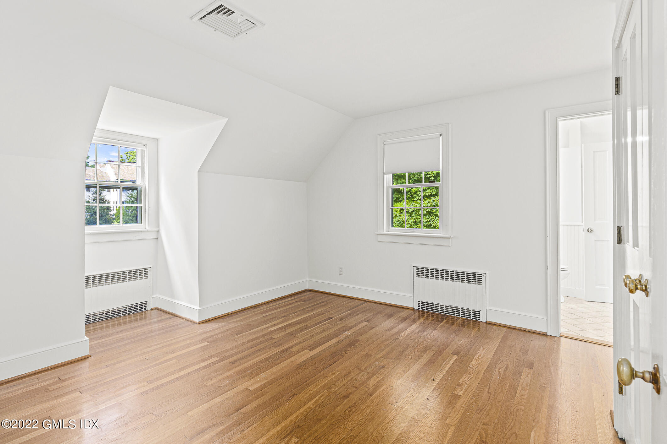 65 Doubling Road Greenwich, CT 06830 - Photo 14 of 18 an empty room with wooden floor and windows
