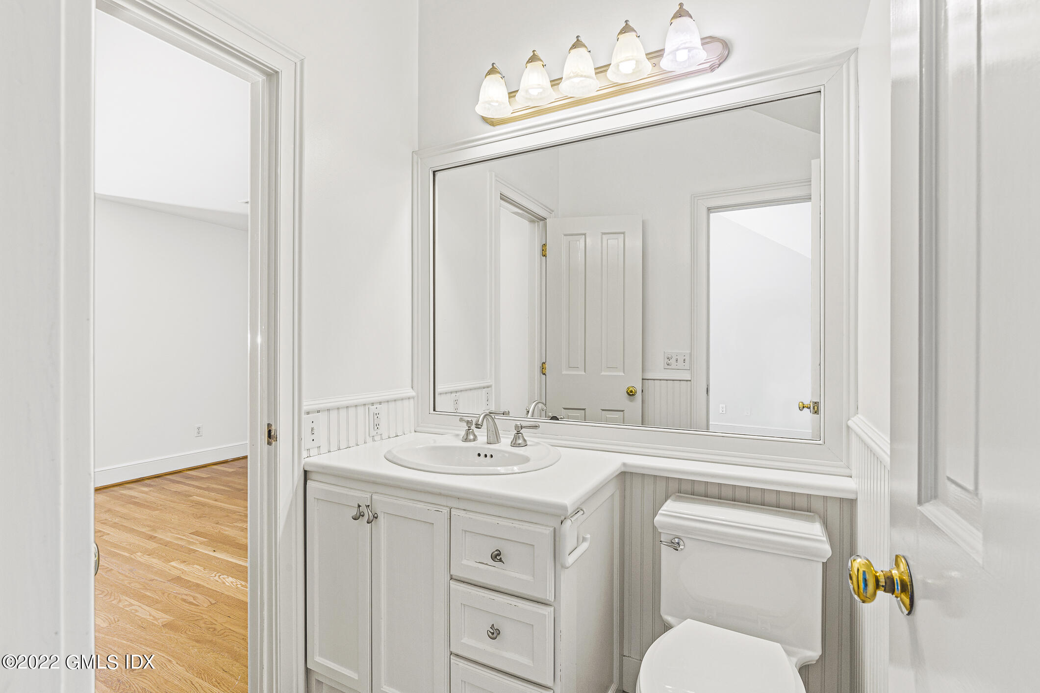 65 Doubling Road Greenwich, CT 06830 - Photo 17 of 18 a bathroom with a sink vanity granite and a mirror