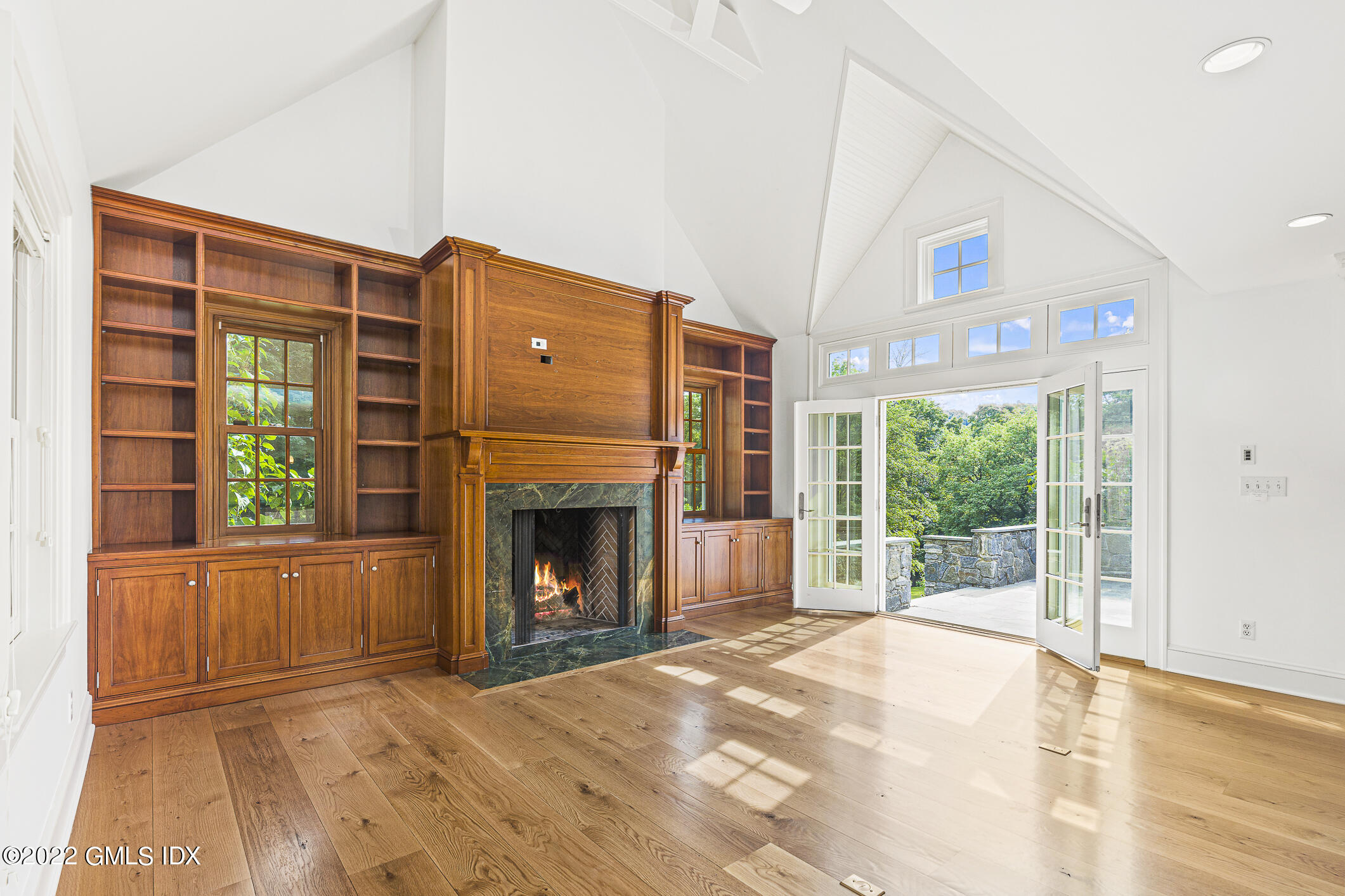 65 Doubling Road Greenwich, CT 06830 - Photo 10 of 18 a view of an empty room with a fireplace and a window