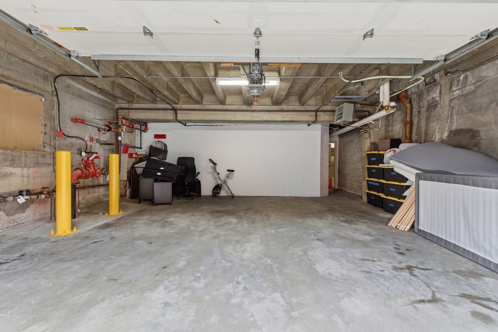 27 Commonwealth Avenue, Unit 1 Newton, MA 02467 - Photo 16 of 18 a view of a garage with storage
