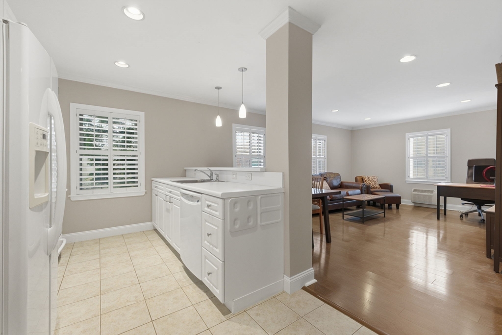 27 Commonwealth Avenue, Unit 1 Newton, MA 02467 - Photo 18 of 18 a kitchen with sink and cabinets
