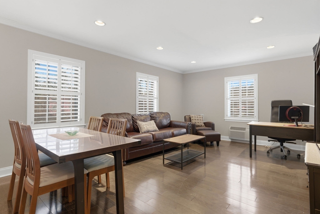 27 Commonwealth Avenue, Unit 1 Newton, MA 02467 - Photo 2 of 18 a workspace with furniture and a window