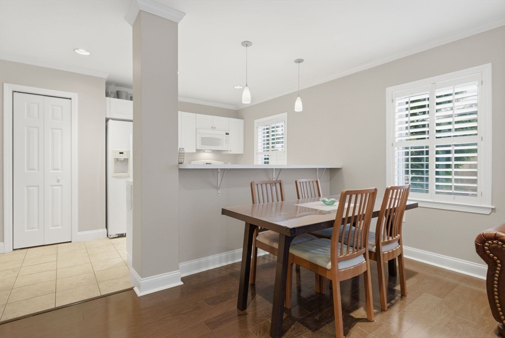 27 Commonwealth Avenue, Unit 1 Newton, MA 02467 - Photo 6 of 18 a view of a dining room with furniture and window