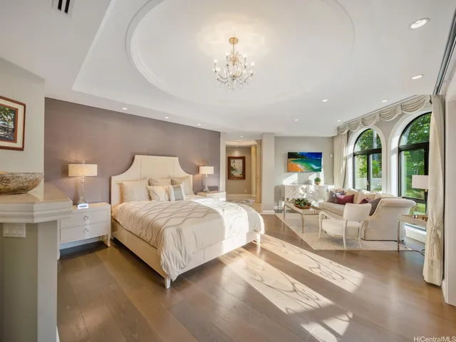 a bathroom with a tub a sink and a mirror