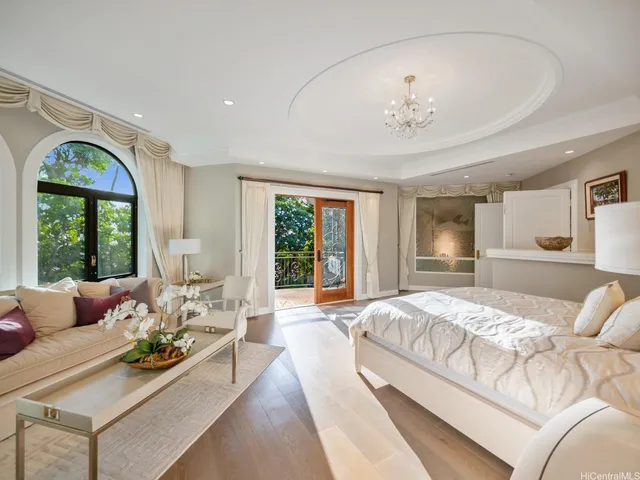 a living room with furniture and stairs