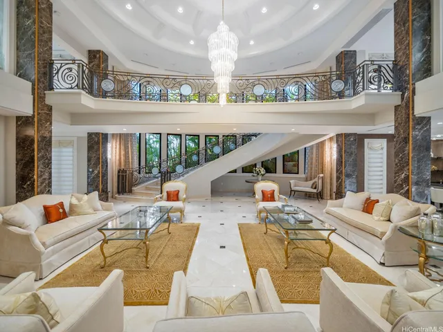 a front view of a house with a yard and fountain