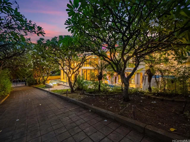 a front view of a house with garden