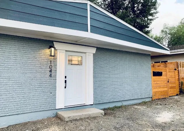 a kitchen that has a sink and a stove in it