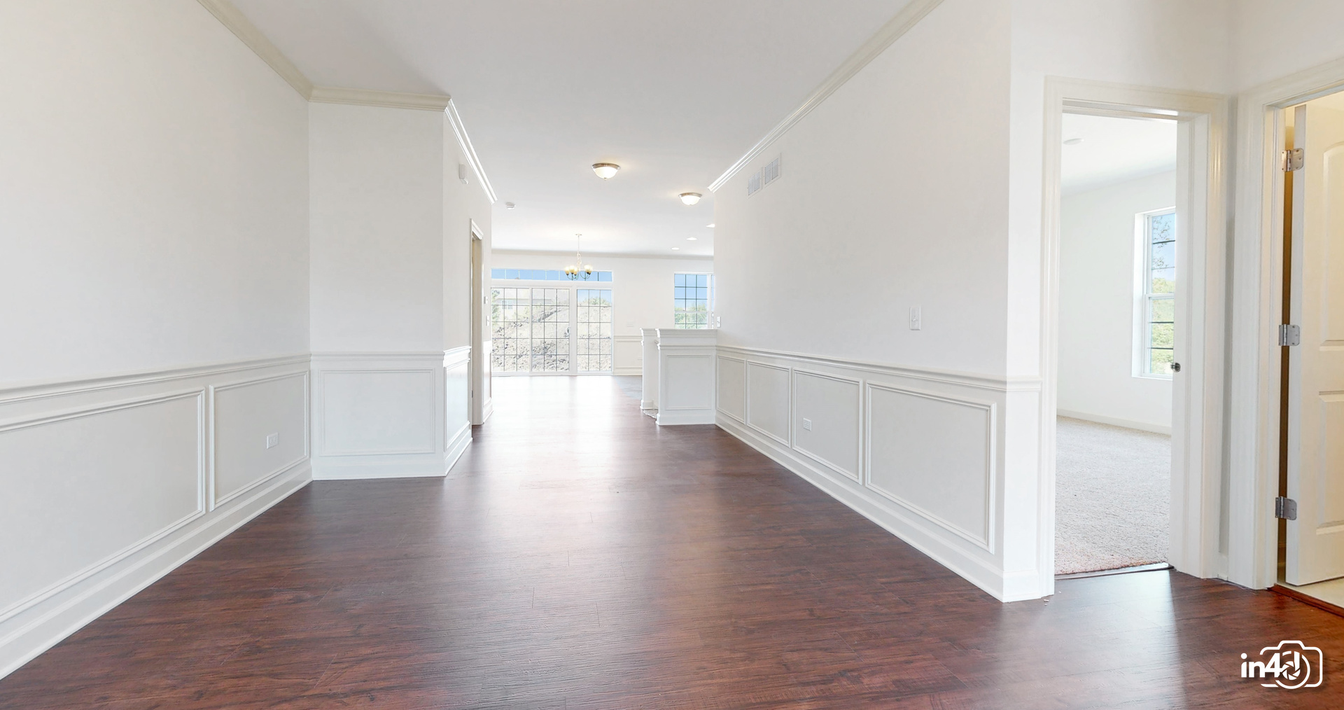 16436 Harmon Lane Plainfield, IL 60586 - Photo 4 of 30 a view of a hallway with wooden floor