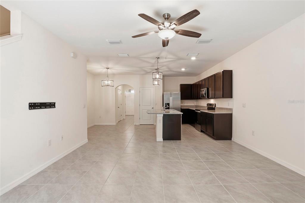 13775 Northwest 9th Road Newberry, FL 32669 - Photo 11 of 33 a view of a kitchen with a sink stainless steel appliances and cabinets