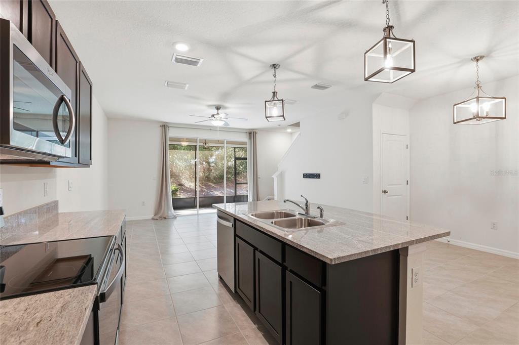 13775 Northwest 9th Road Newberry, FL 32669 - Photo 15 of 33 a kitchen with sink and microwave