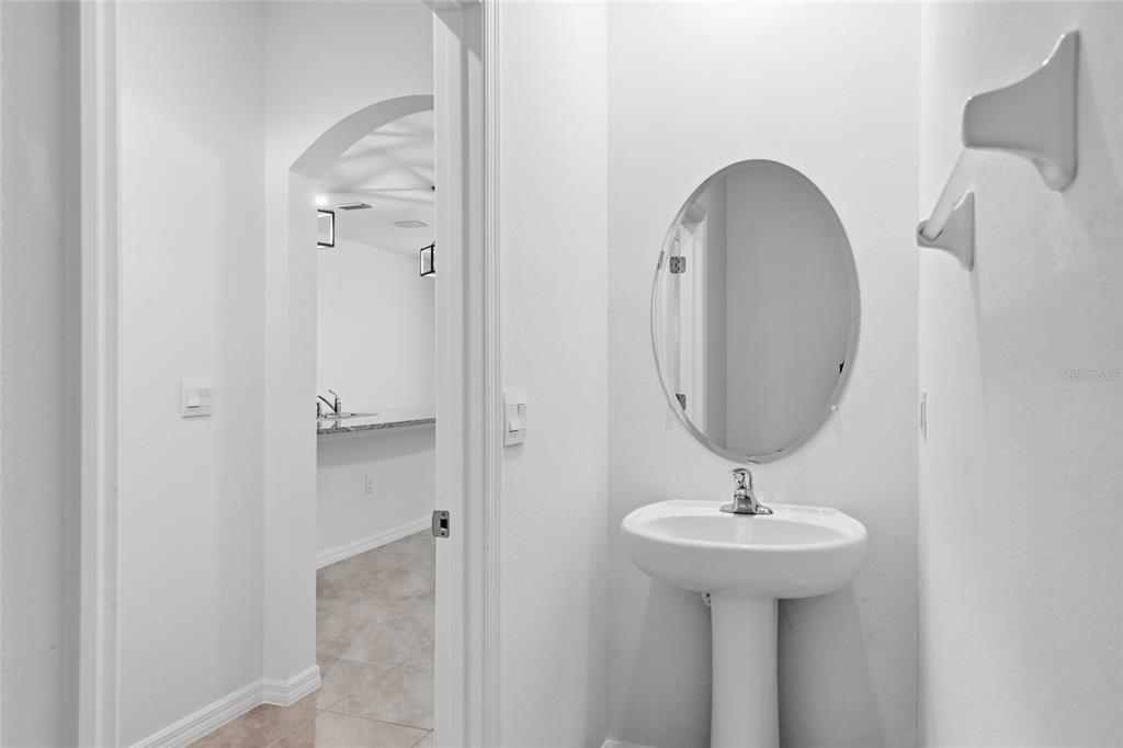 13775 Northwest 9th Road Newberry, FL 32669 - Photo 17 of 33 a bathroom with a sink and a mirror