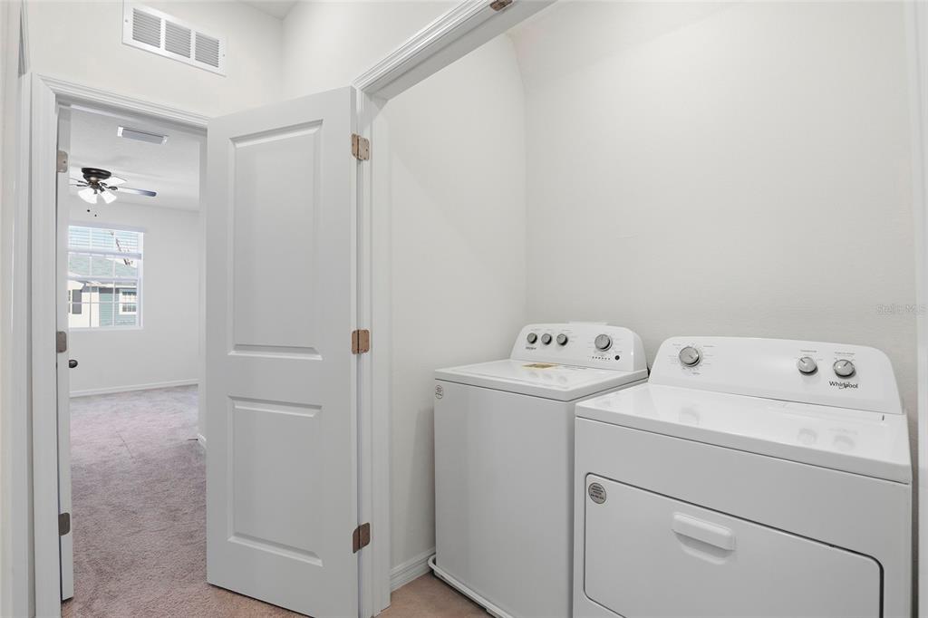 13775 Northwest 9th Road Newberry, FL 32669 - Photo 27 of 33 a view of storage and utility room with washer and dryer
