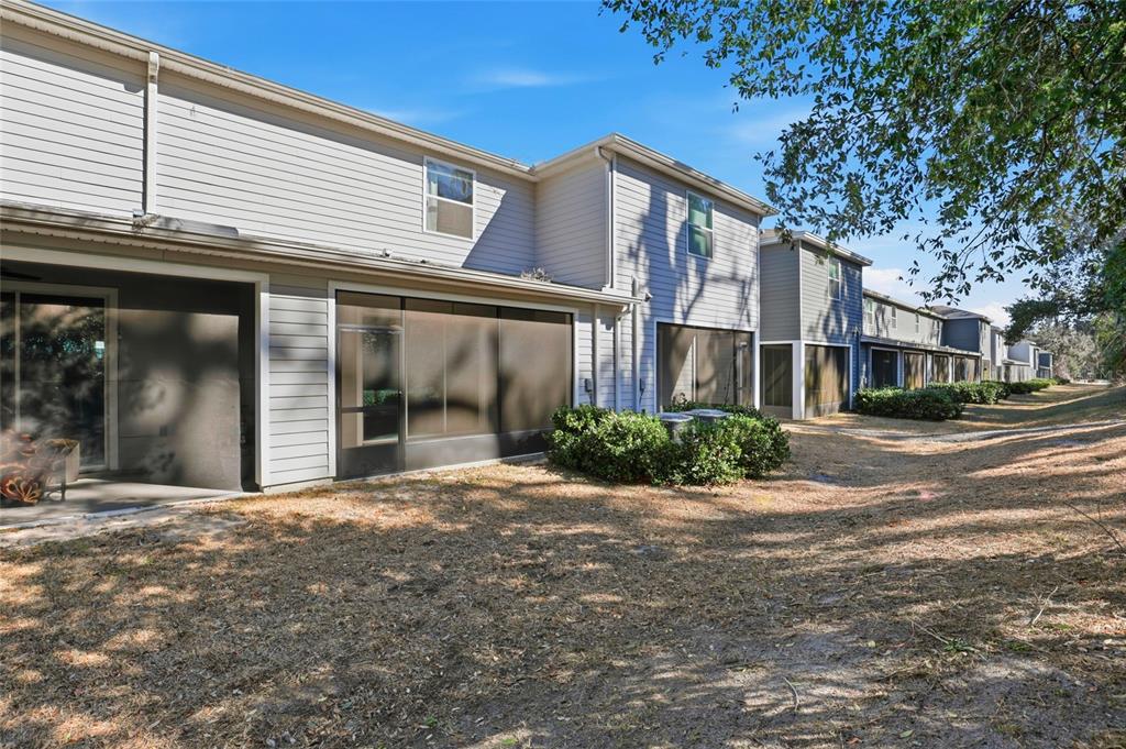 13775 Northwest 9th Road Newberry, FL 32669 - Photo 31 of 33 a view of a white house with a large tree