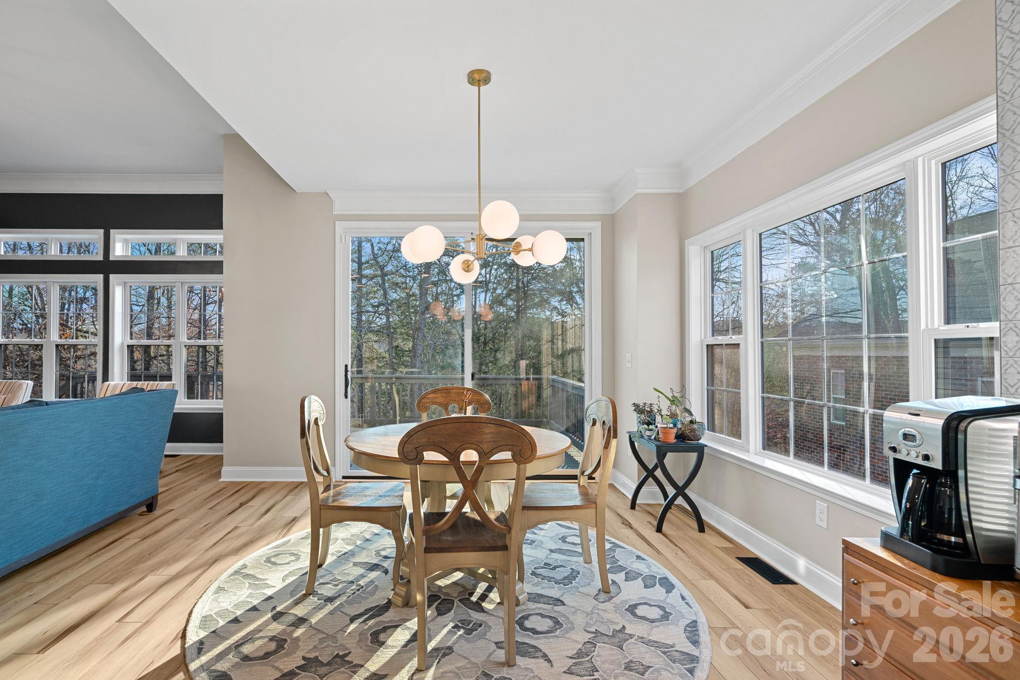 1470 Valhalla Drive Denver, NC 28037 - Photo 14 of 41 a dining room with furniture a chandelier and wooden floor