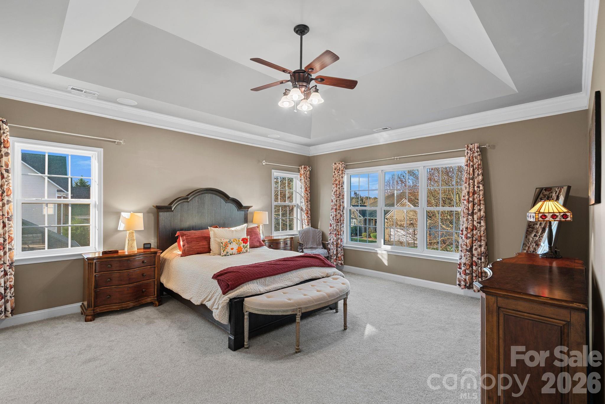 1470 Valhalla Drive Denver, NC 28037 - Photo 17 of 41 a bedroom with a bed and large windows