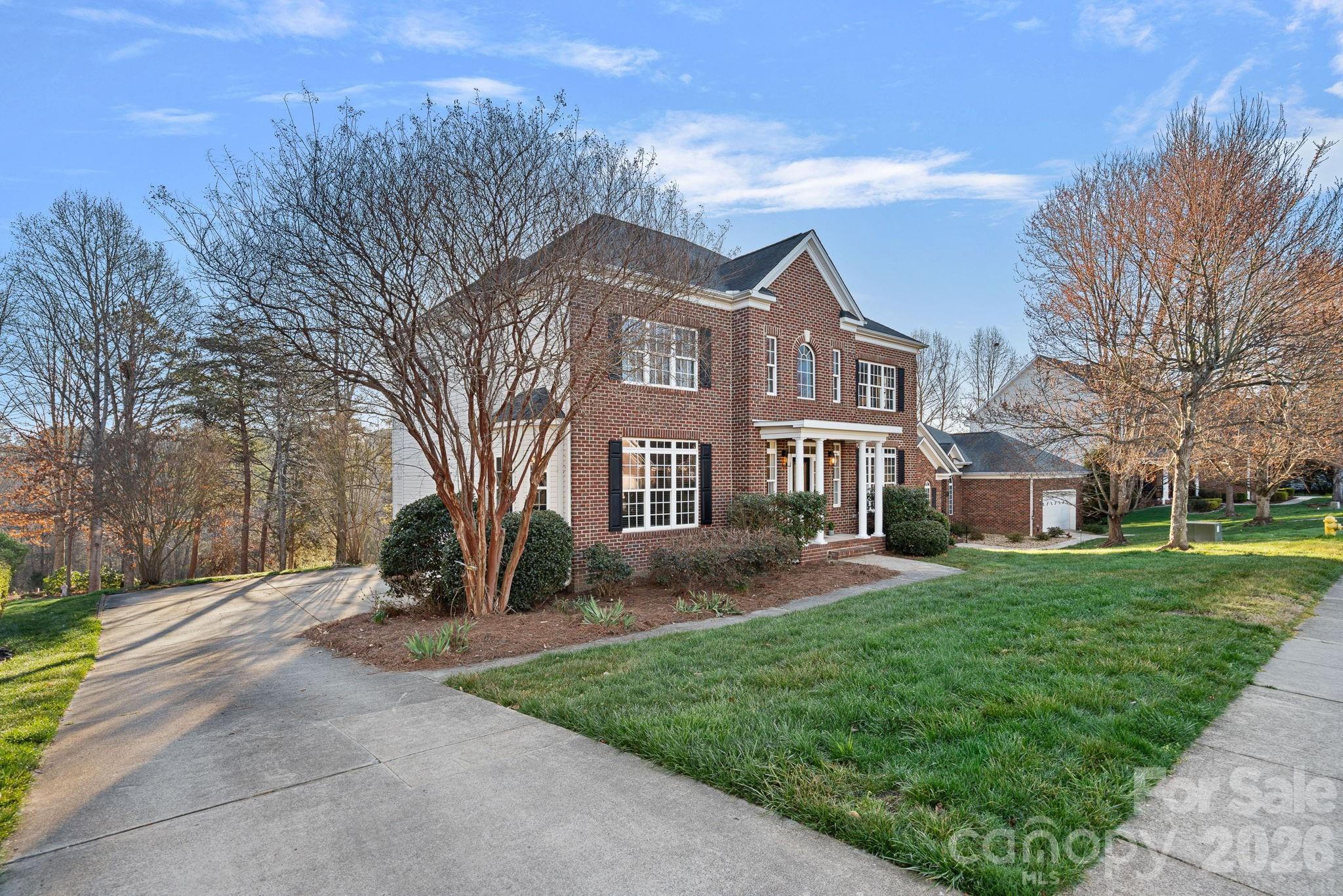 1470 Valhalla Drive Denver, NC 28037 - Photo 2 of 41 a front view of a house with a yard and trees