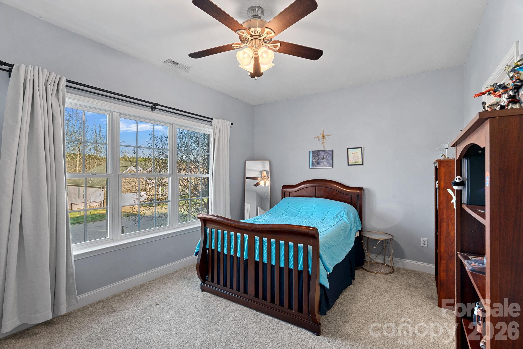 1470 Valhalla Drive Denver, NC 28037 - Photo 21 of 41 a bedroom with a bed and a window