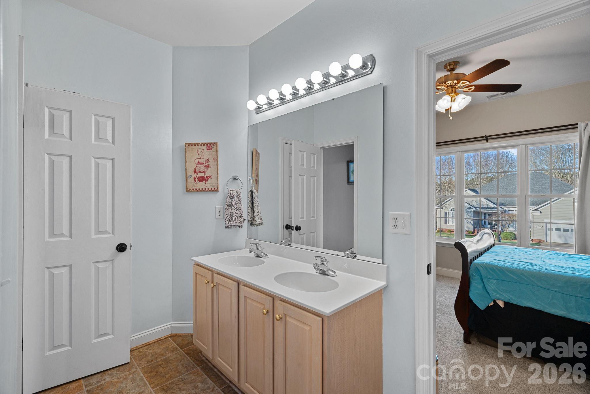 1470 Valhalla Drive Denver, NC 28037 - Photo 22 of 41 a bathroom with a sink double vanity and a mirror