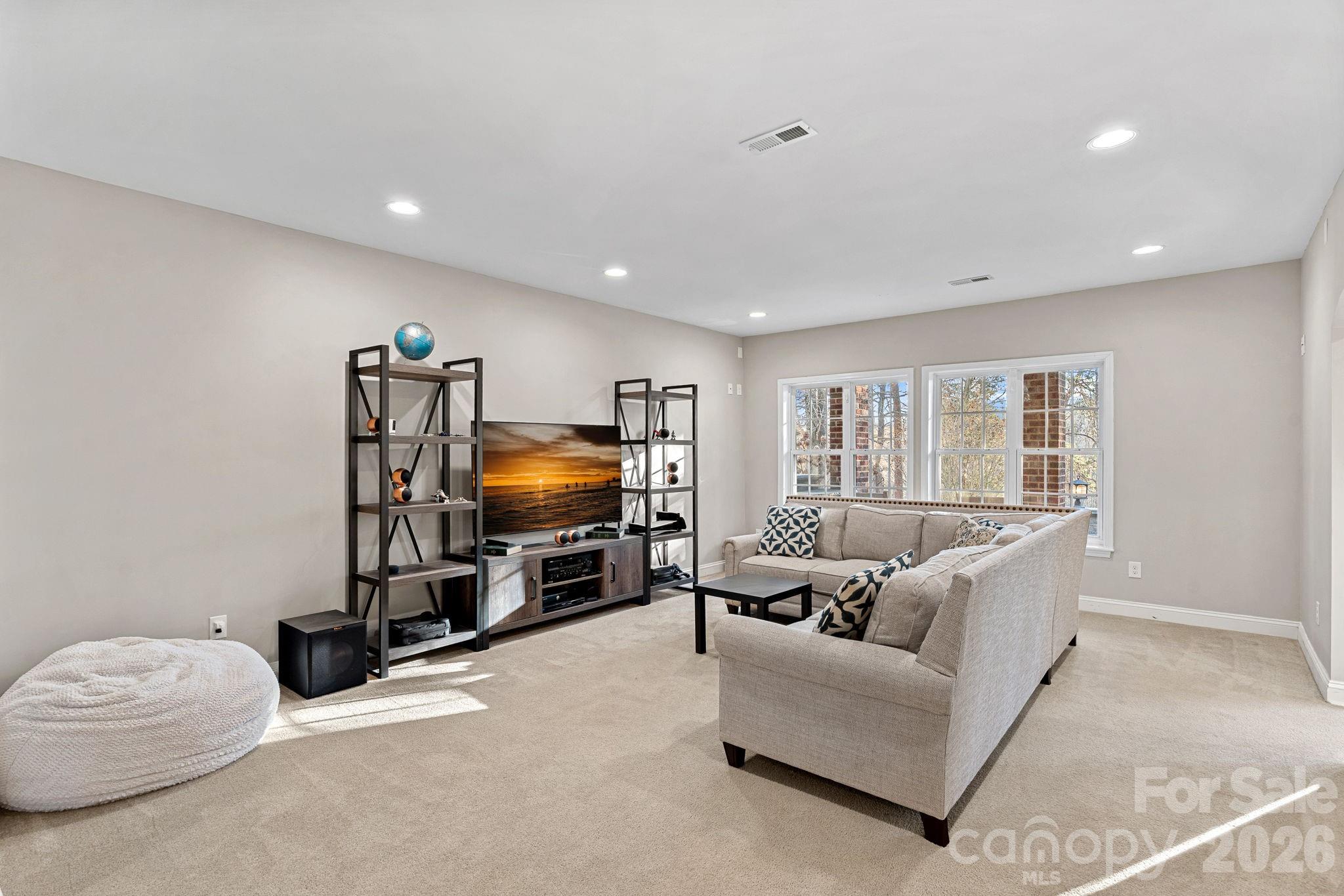 1470 Valhalla Drive Denver, NC 28037 - Photo 26 of 41 a living room with furniture and a flat screen tv