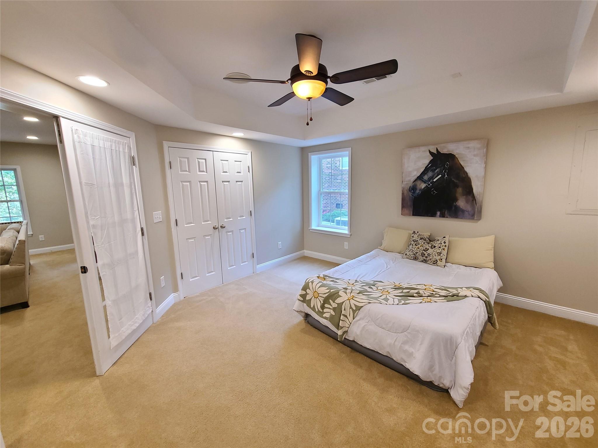 1470 Valhalla Drive Denver, NC 28037 - Photo 27 of 41 a bedroom with a bed and a walk in closet