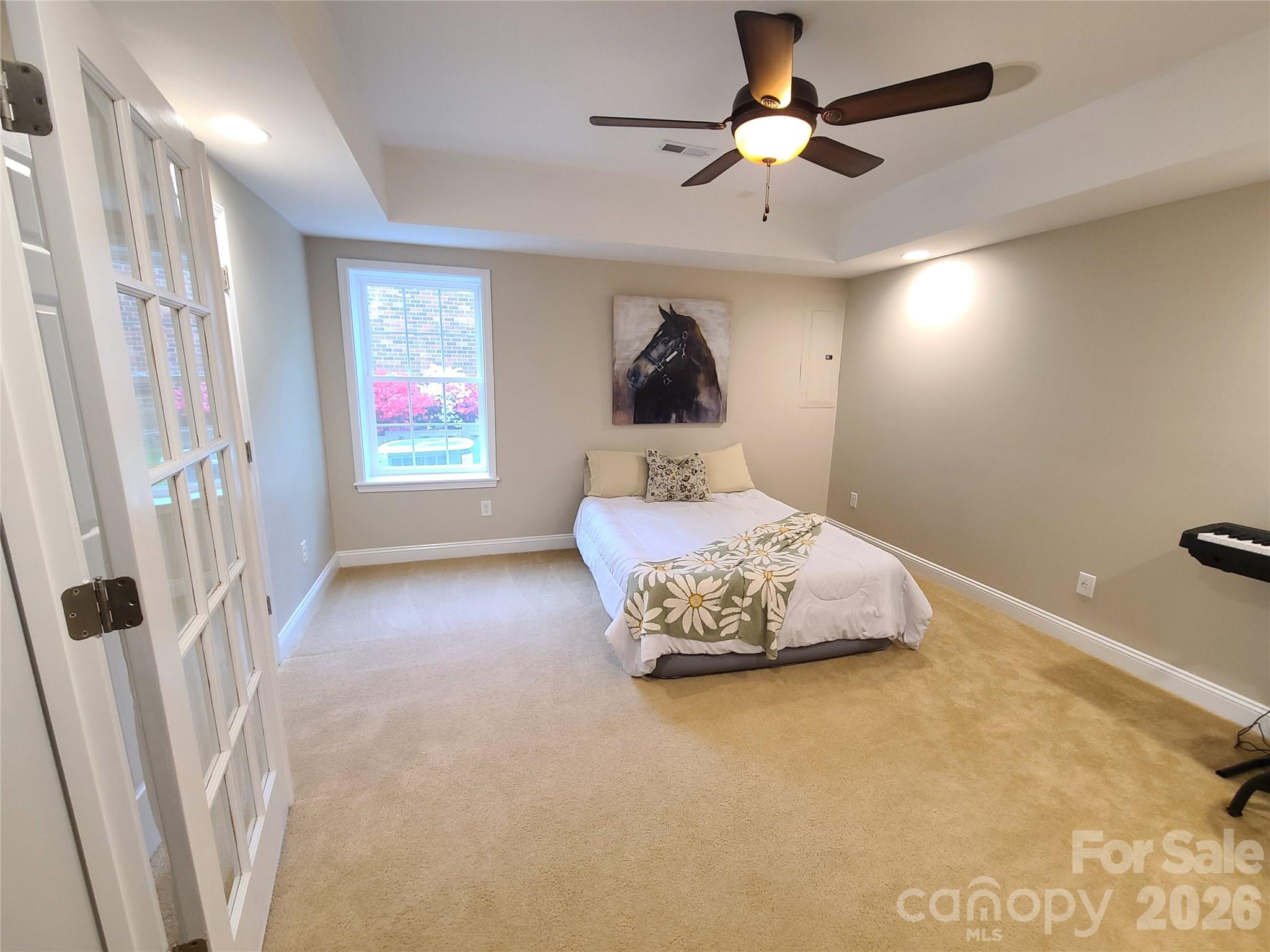 1470 Valhalla Drive Denver, NC 28037 - Photo 28 of 41 a bedroom with a bed and a chandelier