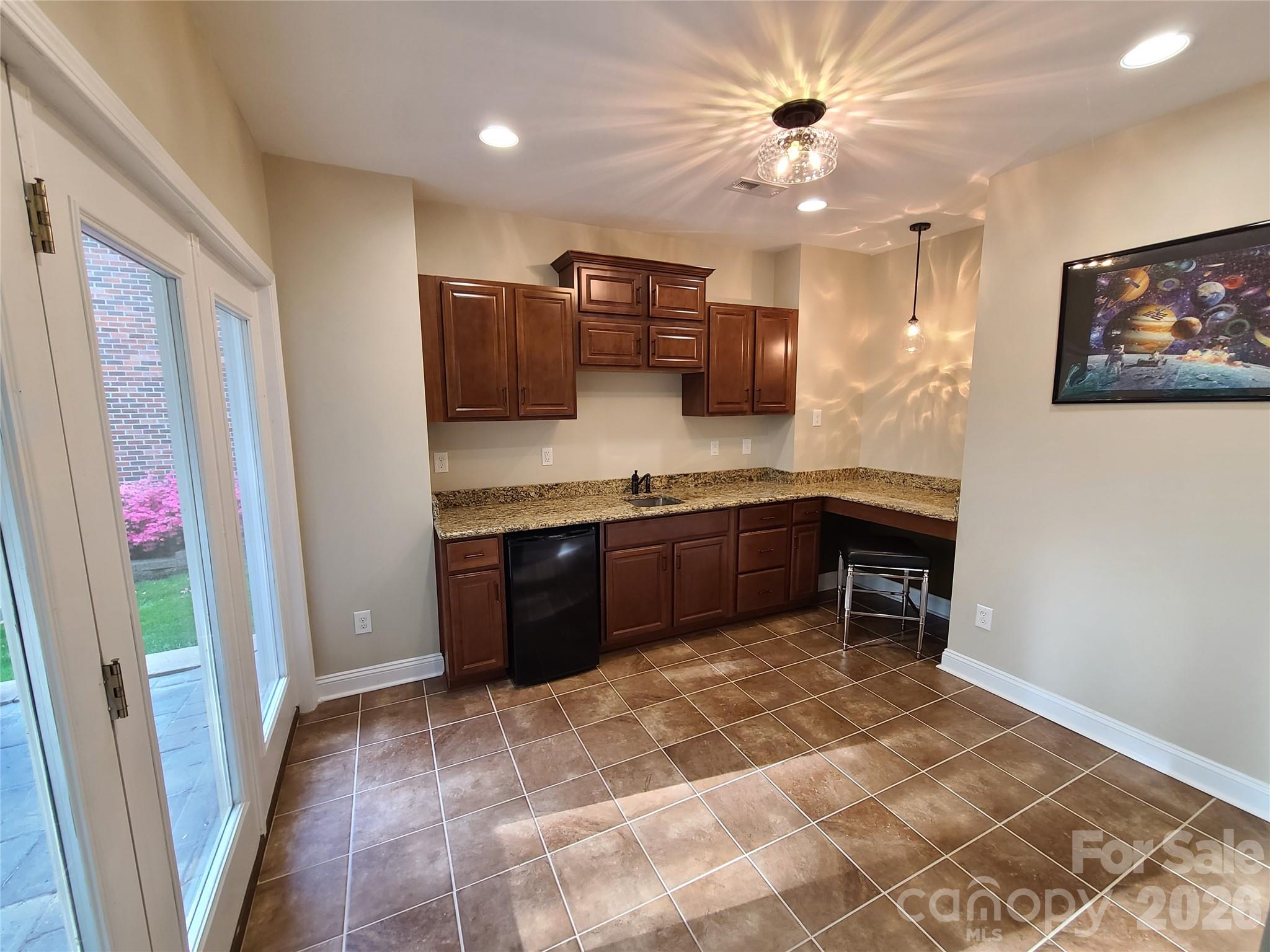 1470 Valhalla Drive Denver, NC 28037 - Photo 30 of 41 a kitchen with stainless steel appliances granite countertop a stove a sink and a refrigerator