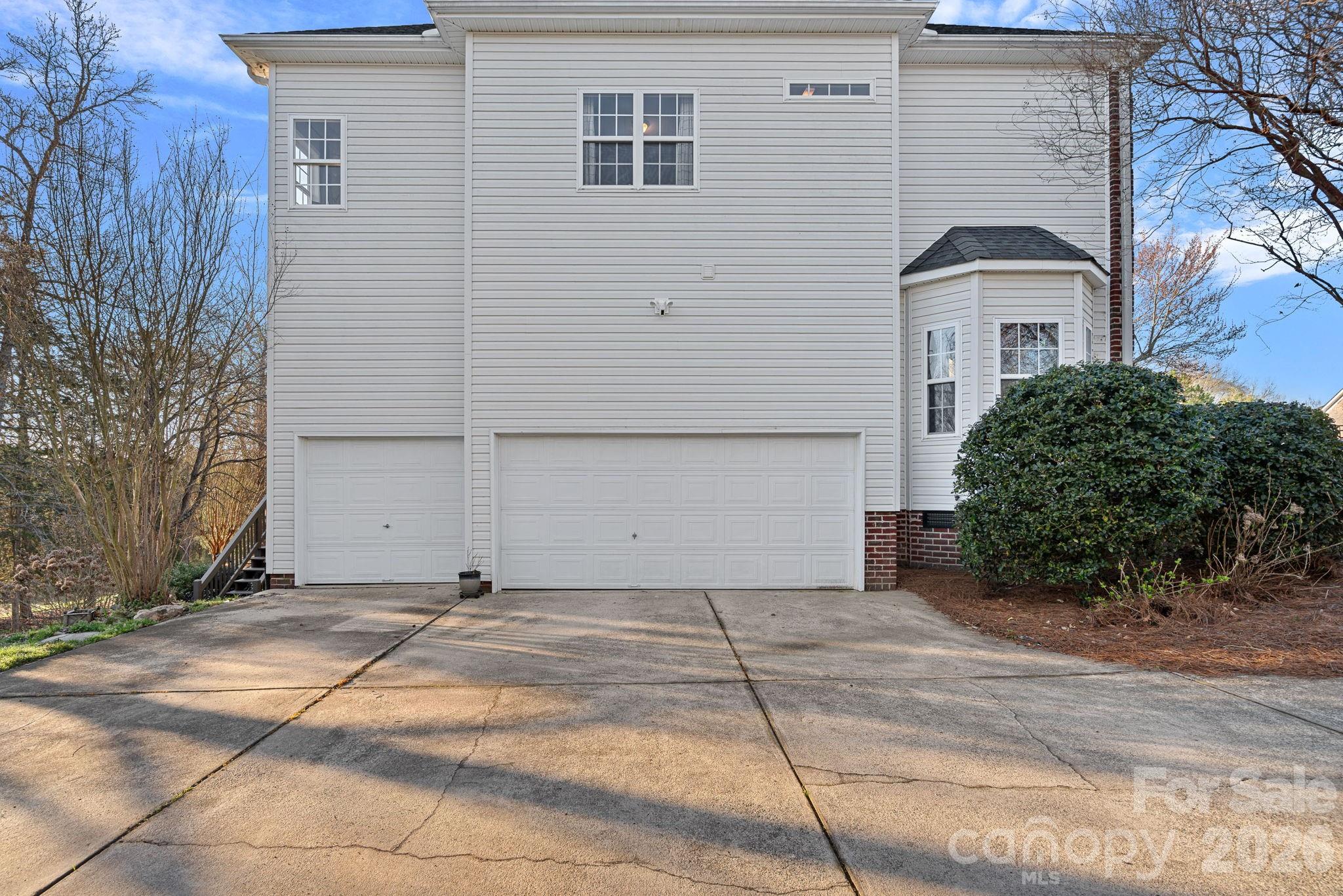 1470 Valhalla Drive Denver, NC 28037 - Photo 35 of 41 a front view of a house with a yard and garage