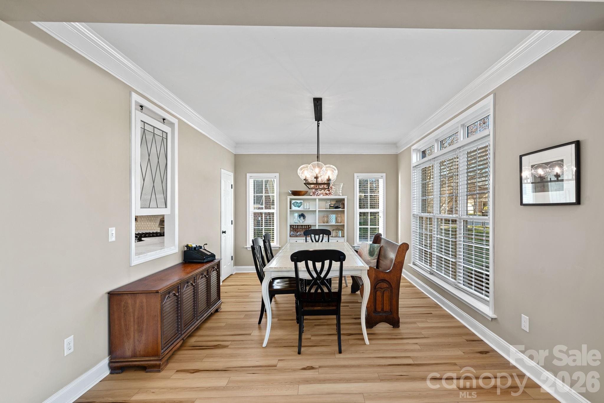1470 Valhalla Drive Denver, NC 28037 - Photo 9 of 41 a view of a dining room with furniture window and wooden floor
