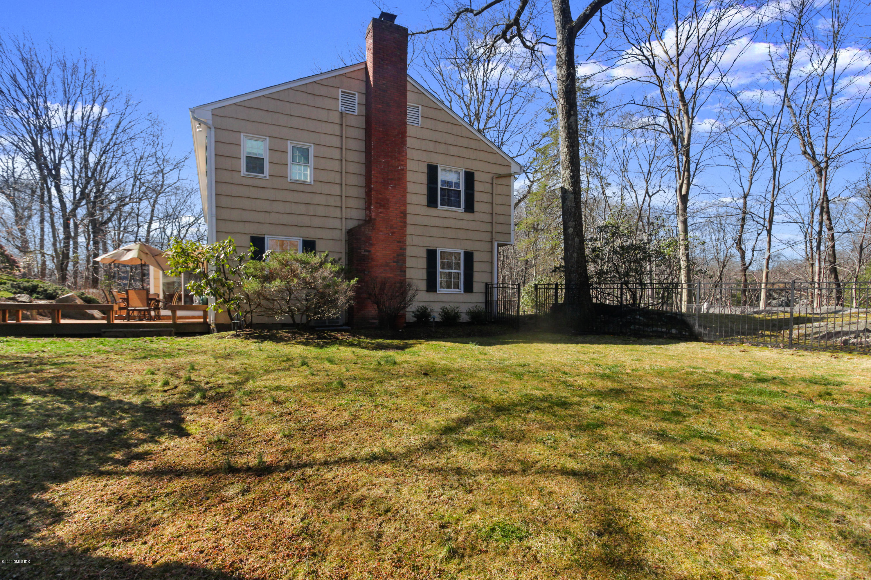 31 Horseshoe Road Cos Cob, CT 06807 - Photo 29 of 34 side yard with deck house