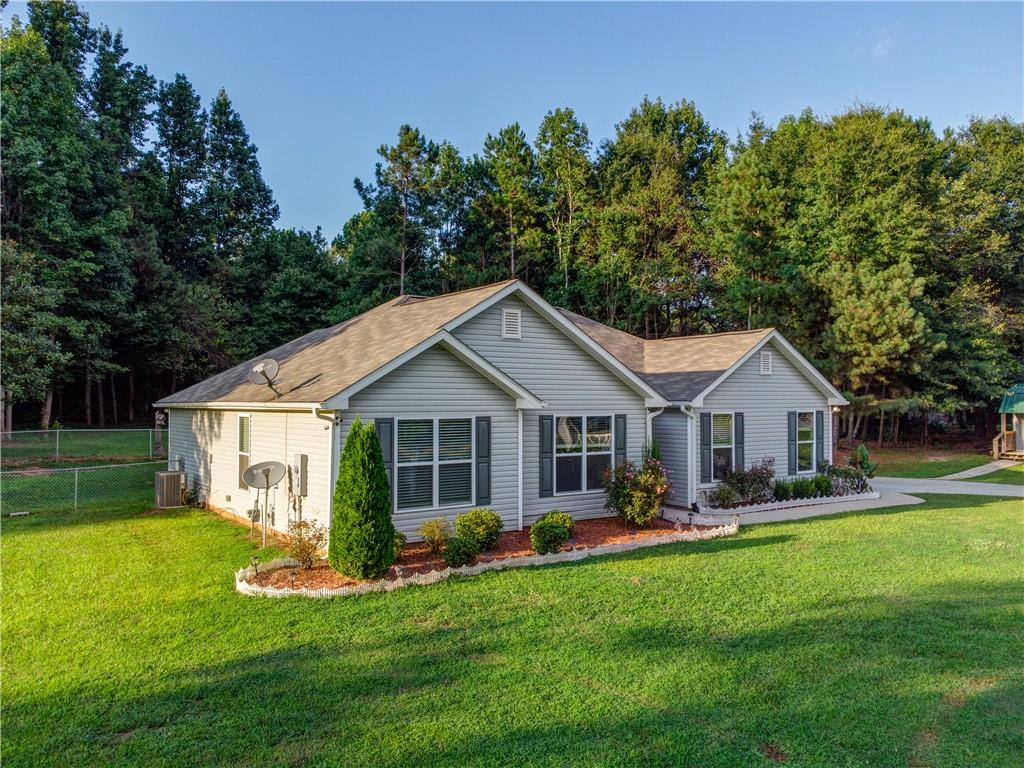 205 Nebo Road Dallas, GA 30157 - Photo 1 of 1 a front view of a house with a yard and green space
