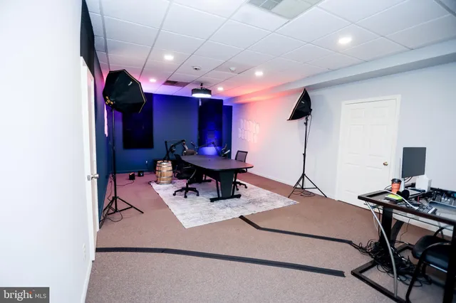 a bathroom with a toilet and a shower curtain