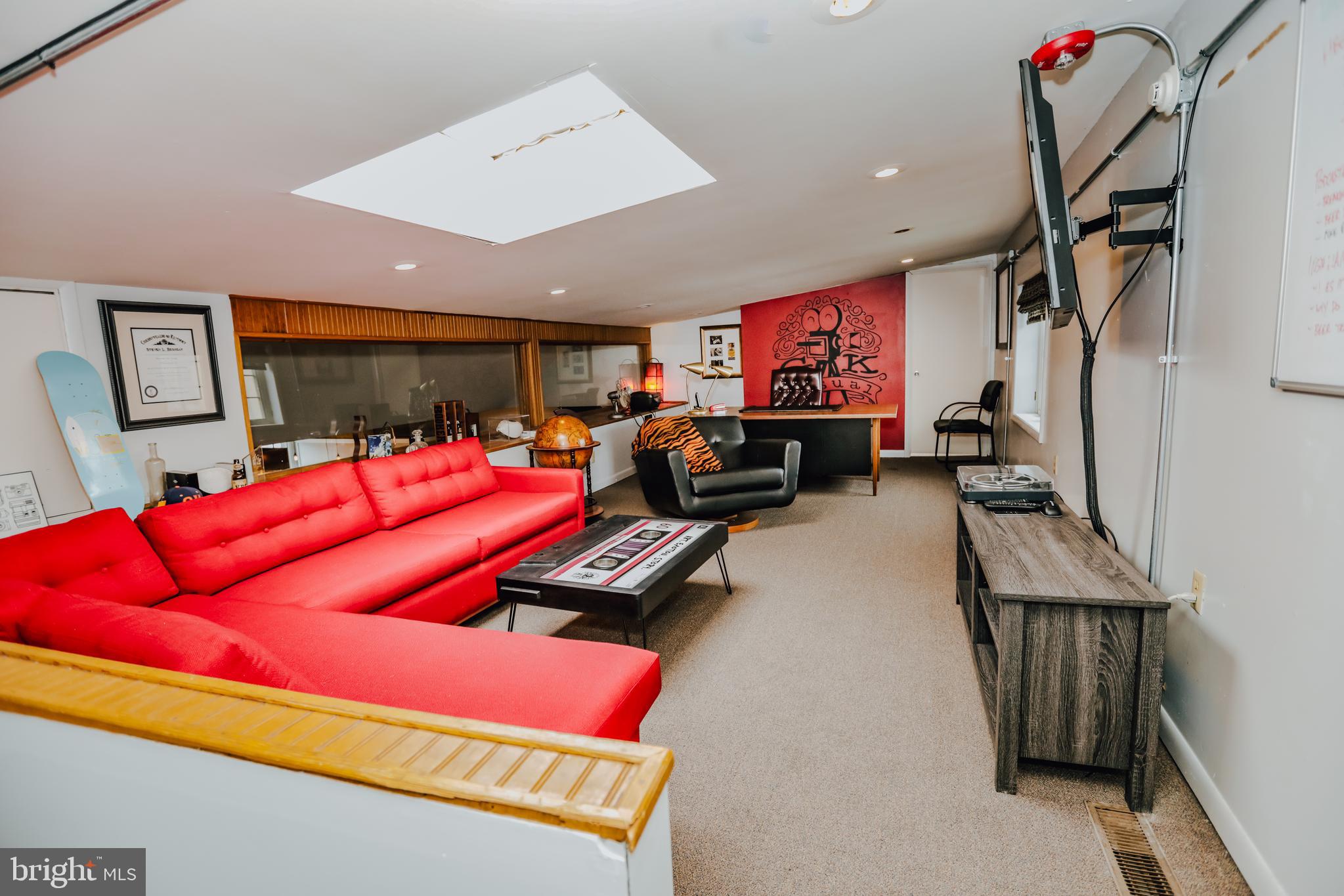 933 Rose Street Harrisburg, PA 17102 - Photo 29 of 98 a living room with furniture gym equipment and a flat screen tv