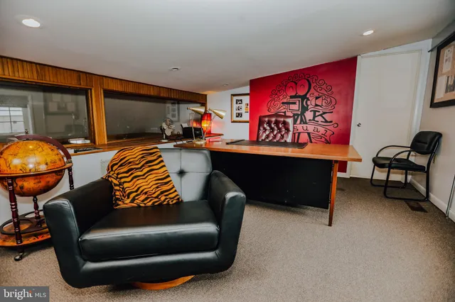 a view of a livingroom with furniture and window