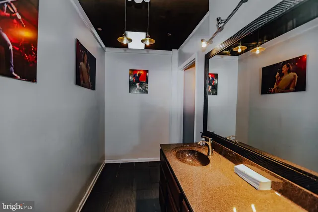 a kitchen with stainless steel appliances kitchen island granite countertop a refrigerator and stove