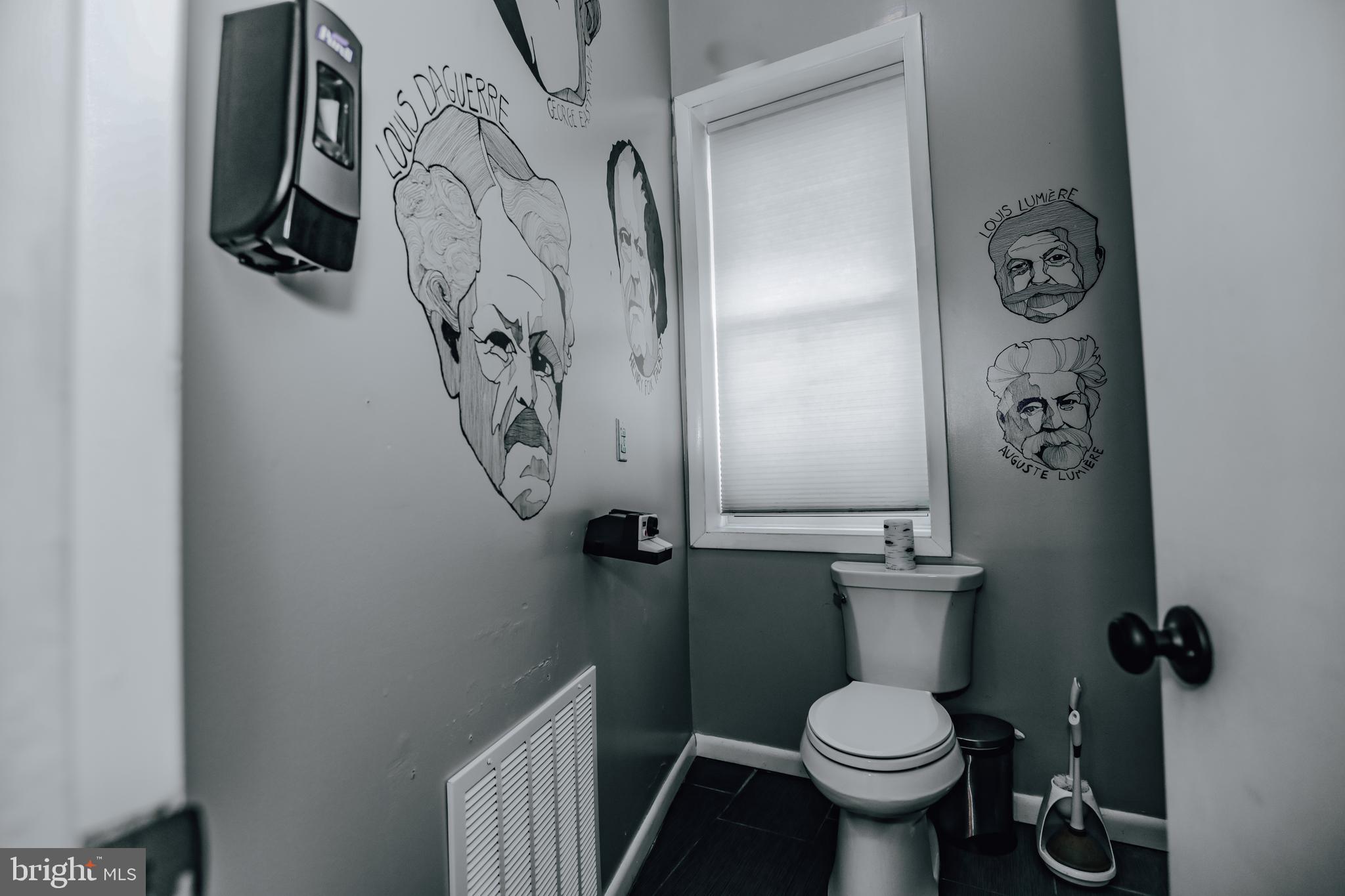 933 Rose Street Harrisburg, PA 17102 - Photo 40 of 98 a bathroom with a toilet and a shower curtain