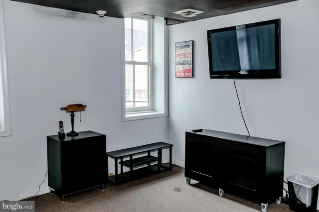 a kitchen with a sink a counter and cabinets