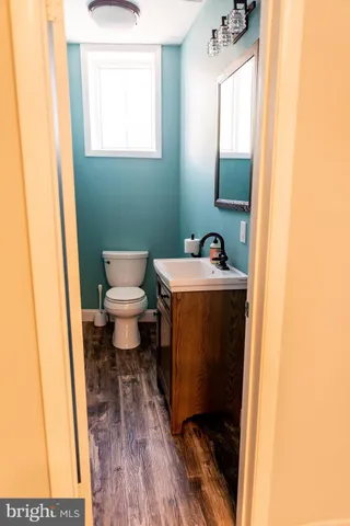 a view of a livingroom with a ceiling fan and window