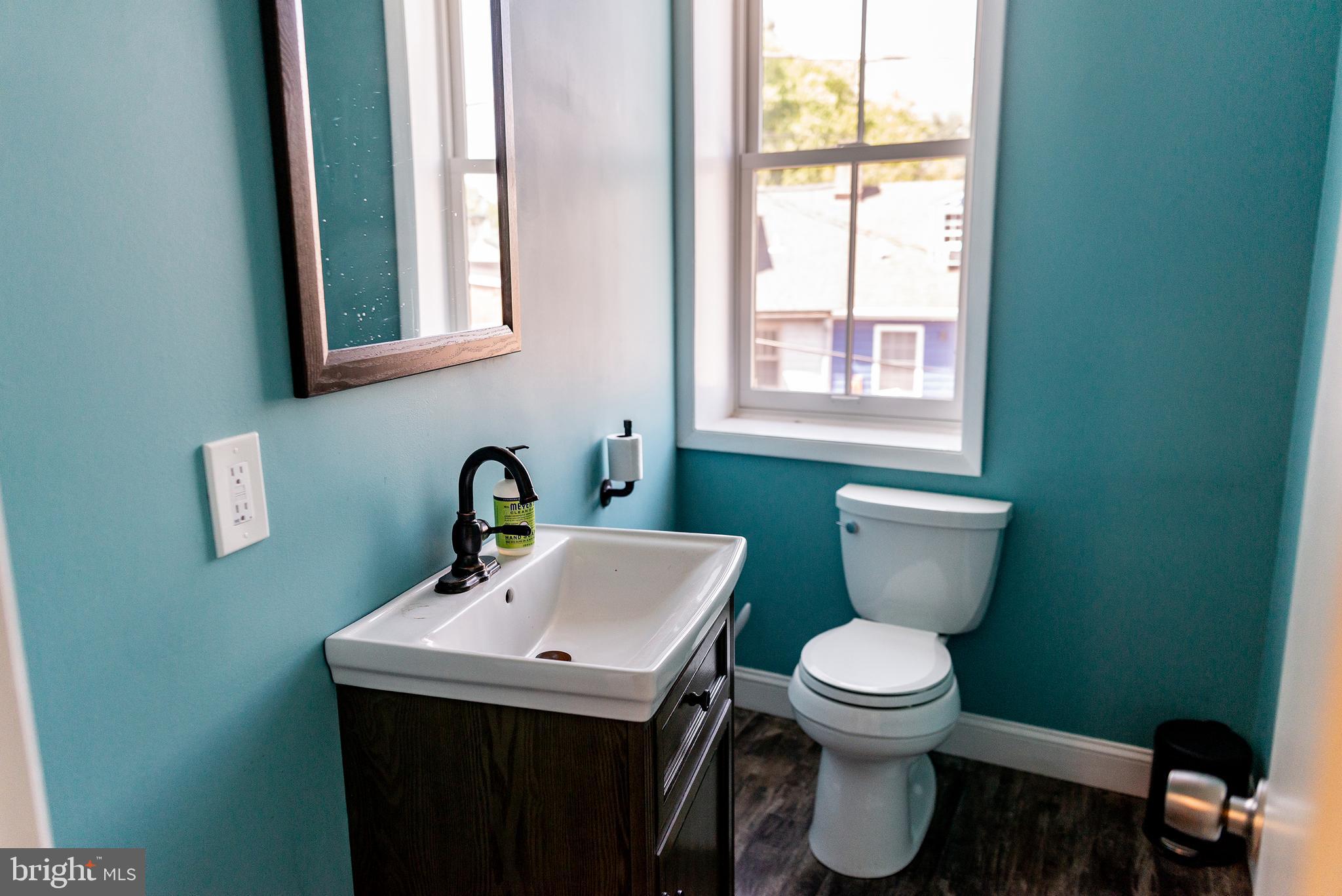 933 Rose Street Harrisburg, PA 17102 - Photo 48 of 98 a bathroom with a toilet sink and mirror