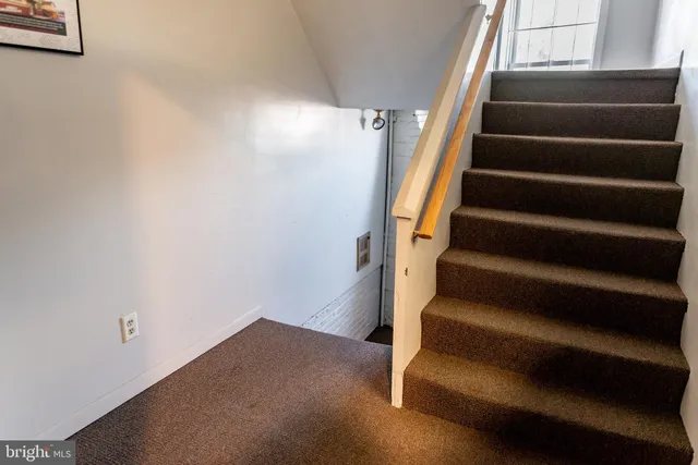 a front view of a building with a yard