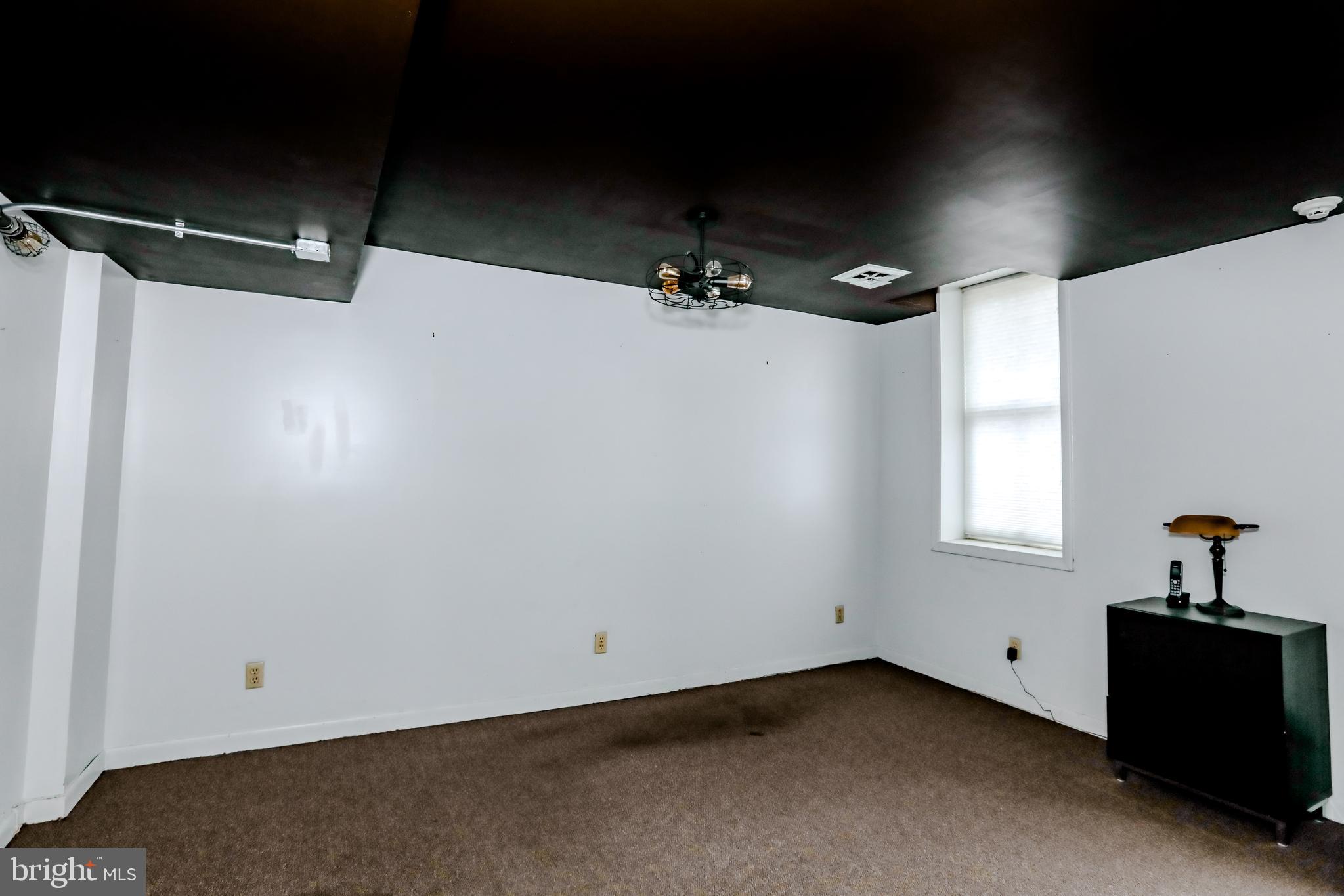 933 Rose Street Harrisburg, PA 17102 - Photo 90 of 98 a view of a livingroom with a ceiling fan and window