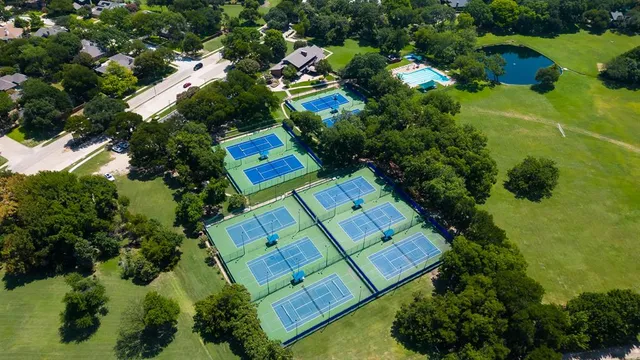 an aerial view of residential house with outdoor space and swimming pool